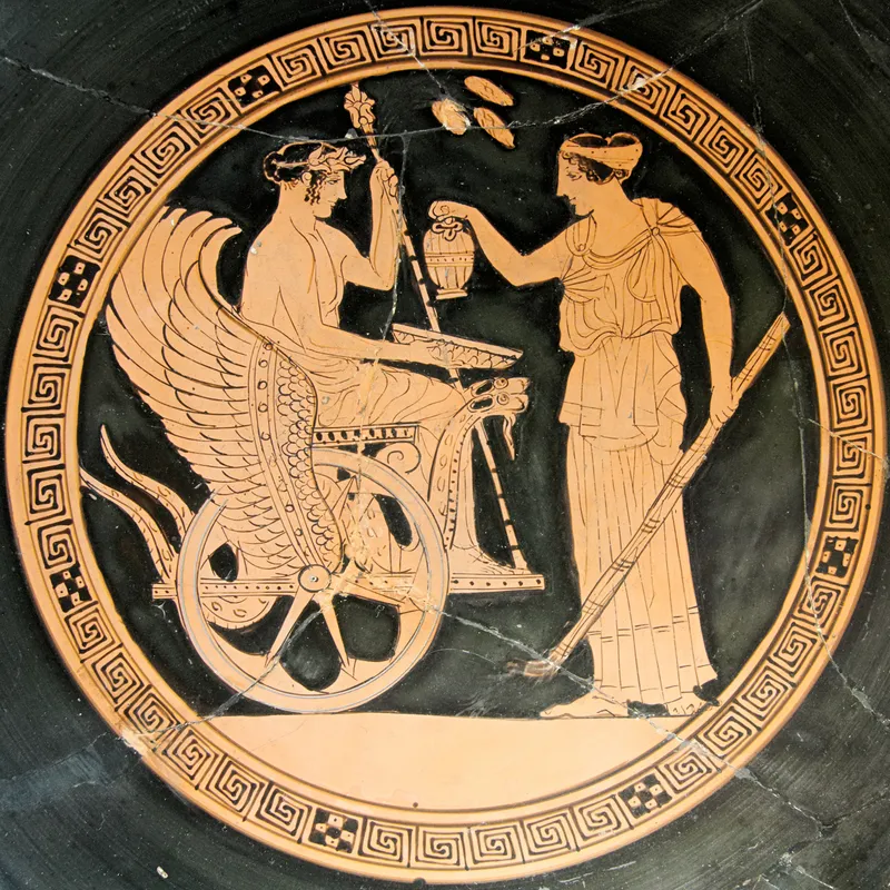 Red-figure cup interior: Triptolemos seated on a winged chariot holding ears of wheat, a goddess pouring him a libation.