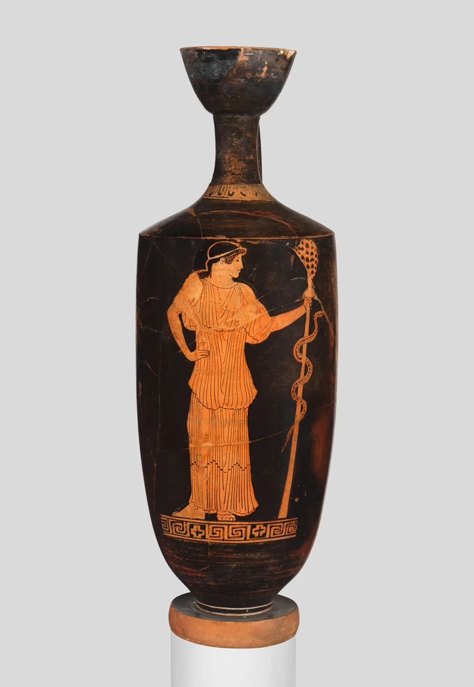 A Greek maenad handling a serpent on a painted vessel.