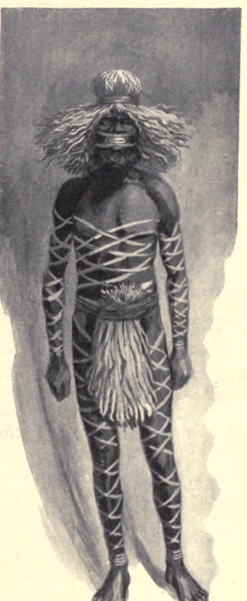 A man decorated for the Kuringal ceremony, wound from shoulder to ankle in stringy-bark fibre, wearing a fibre wig, his lips drawn back by cords to bare the teeth