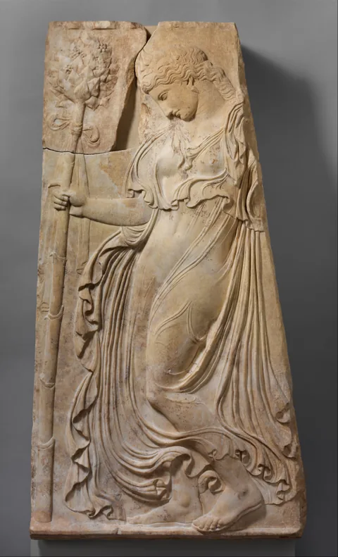 Marble relief of a dancing maenad.