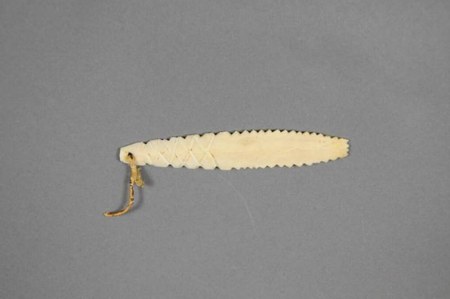 Representative—not this record’s object: an ivory bullroarer from Sanikiluaq in the Canadian Arctic.