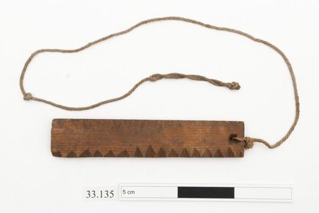 Wooden bull-roarer found on the County Antrim shore, 1905 — representative Irish object. Horniman 33.135.