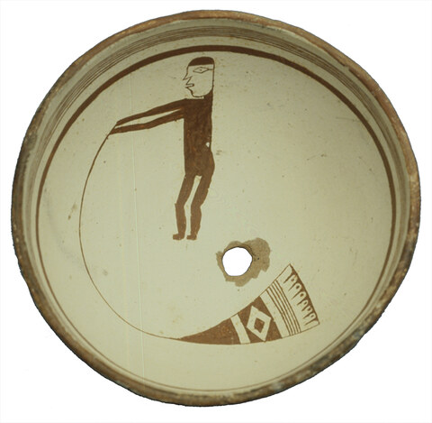 Mattocks-site Mimbres bowl with the scene Brody reads as a man whirling a bullroarer.