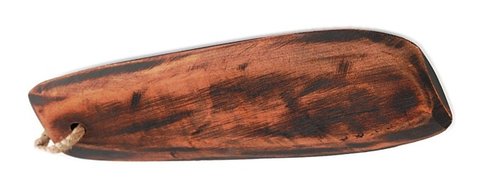 A Galician wooden zoadeira, a flat reddish-brown board with a cord tied through a hole near one end.