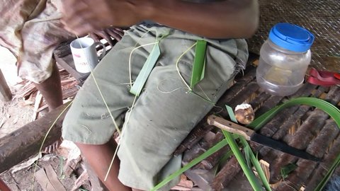 Coconut-leaf frfr blades being made at Rouku in 2012.