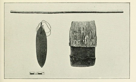 Hollis's plate of Nandi instruments: a bow above, the bullroarer — a dark elongated blade on a looped cord — at center, and a bark-wrapped...