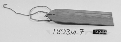 The thunner-spell Walter Gregor sent from Pitsligo to the Pitt Rivers Museum: a plain slat of deal, its string knotted through the rounded end.