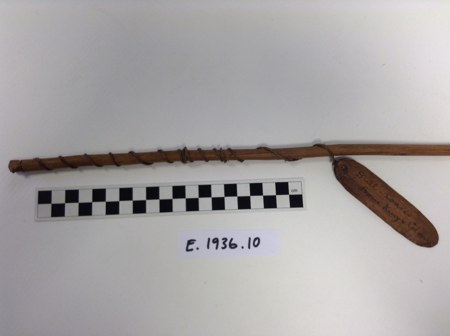 Close view of the rig: the cord spirals down the pole to the small inscribed blade.