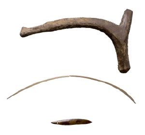 Nationalmuseet's group photograph of purported Mesolithic shaman's equipment — an antler tine, a curved bone rod, and, at bottom, the thin...