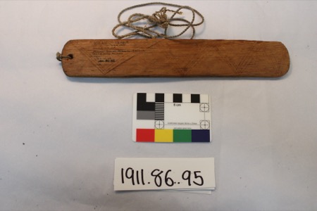The ual ual ii'g agual, a Yavapai medicine bull-roarer from Fort McDowell: a flat cottonwood board, cut from a lightning-struck tree, incised...