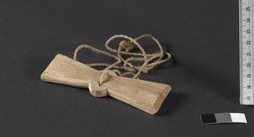 The Karbi blade itself on its twisted cord (UEM46949); the museum catalogues it simply as a toy.