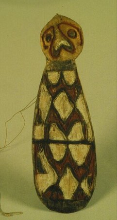 A bulbous, tapering wooden form wound at the neck with a thick coil of cord — the Northwest Asmat bromhout documented here, catalogued by the...