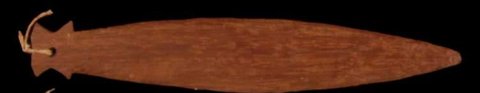 Furtedjuwi bullroarer from Kapriman, Kambaramba: a smooth brown blade with a tapered rounded tip, arrow-shaped shoulders and cord tied through a hole at the opposite end.