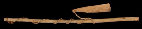 A Gond burunga from Gotpal, Bastar: a long wooden handle below a separate flat blade, linked by cord that loops around the handle.
