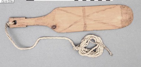 Representative—not this record’s object: a painted Tembé bullroarer from Brazil.