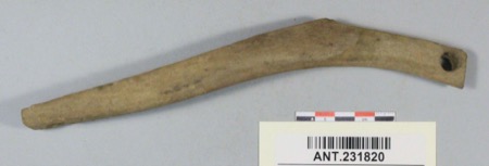 Representative—not this record’s object: an antler bullroarer from Dividing Point, Alaska.