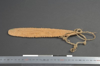 The Netsilik brummer Roald Amundsen carried home from the Gjøa expedition: a pointed wooden blade a little under 24 cm long, its edge cut into...