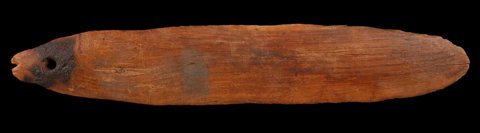 Representative—not this record’s object: a Dogon veni, a wooden slat pierced at one end.