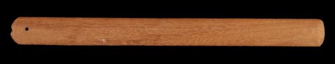 Yoruba eke from the Abomey region: a long, narrow, plain wooden blade with rounded ends and a small hole near one end.