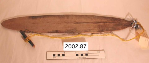 Iatmul bullroarer by Luke Kamangari, Kanganamun, with yellow cord and toggle.