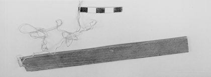 The Brussels planchette ronflante on its cord — MIM inv. 2295.