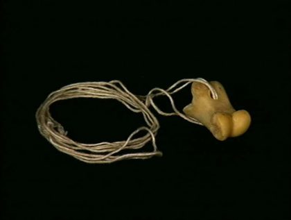 Second view of the bone, hole and knot.