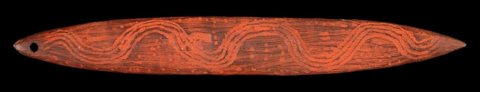 A red-ochred Central Australian bullroarer with five sinuous serpent tracks and a hole near one end.