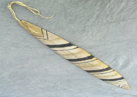 Xingu River bullroarer with a slotted cord end.