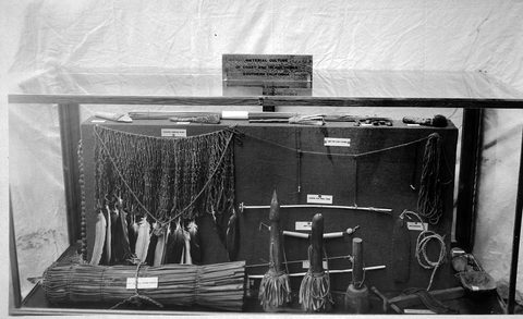 the 1915 Panama-California Exposition case; a bullroarer hangs at right.