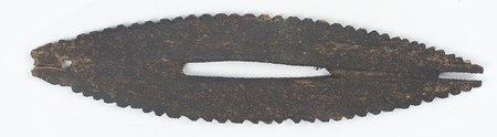 The Mattaponi serrated wooden bull-roarer Speck figured (fig. 134) — museum photograph of the same object, NMAI 9/7738; the long central slot...
