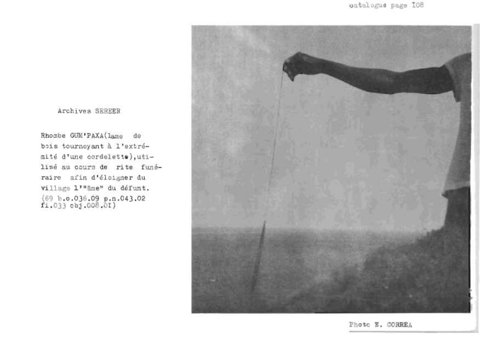 Low-contrast catalogue-page photograph of an arm extending a thin cord over open ground, illustrating the Ndut gum paxa bullroarer; the blade itself is indistinct.