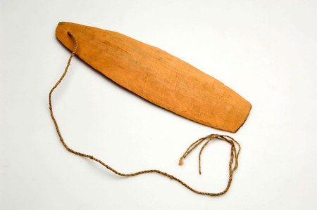 A smooth, reddish-brown Marind bull-roarer from South Papua with a single twisted plant-fibre cord threaded through one end; stands in for the...