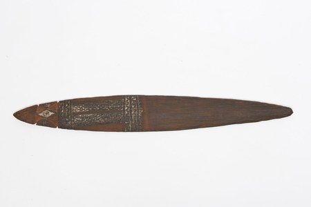 A carved New Guinea bull-roarer from the Madang coast, its head worked into an eye motif above bands of white-pigment diamonds and chevrons;...