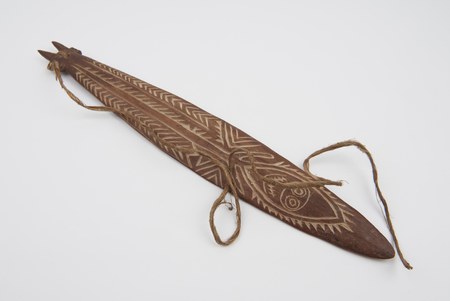 Carved Papuan Gulf bull-roarer with crocodile motif and fibre cord — representative for the Wapo-Era (Gulf). Science Museum Group A1451.