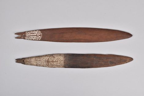 Purari (Maipua) bull-roarers with lime-infilled anthropomorphic carving, Gulf of Papua — British Museum, Oc1906,1013.663–664 (Daniels...