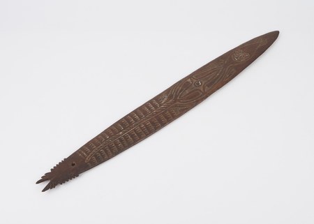 Elema ichthyoform bull-roarer, Papuan Gulf — representative of the Toaripi (an Elema people). Science Museum Group A29976.