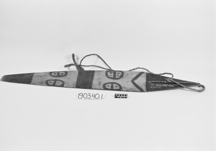 Bororo aidye from the South Lourenço River, made by 1898: a large lanceolate blade with black decoration, terminal perforation, and surviving...