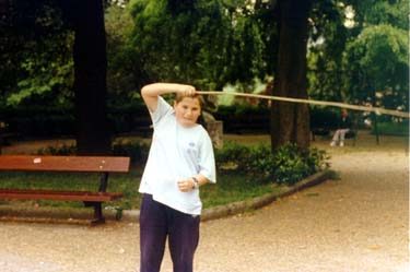 Child playing the ziri / burruna (Basque bull-roarer).