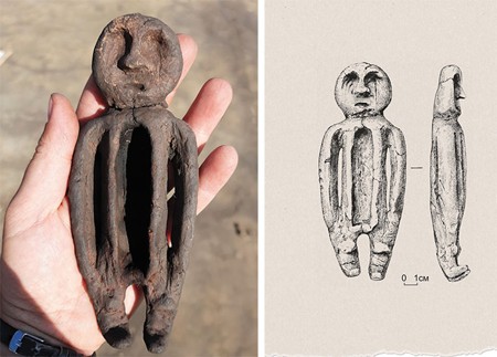 A clay human figure rests in a hand with its head repositioned above a hollow torso; drawings beside it show its face and profile.