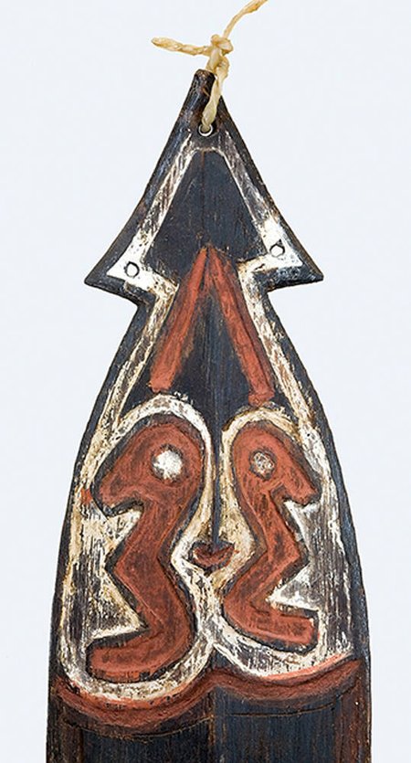 Detail of the arrow head, perforation, cord knot and painted hook figures.