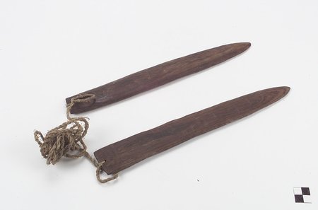 A pair of Comcaac (Seri) wooden blades joined by a fibre cord, Bahía de Kino, Sonora, 1932.