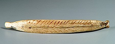 Reverse face of the La Vache blade, engraved with rows of oblique strokes along a central line.