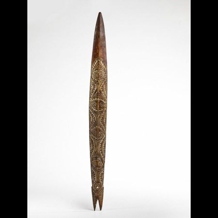 Sosom board 71.1931.49.22: ancestor faces stacked down the blade to a fish-tail butt.