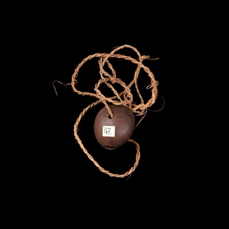 One Womel seed-whirler, drilled and strung on plaited fibre (MQB 71.1936.40.51).