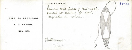 Another Haddon register card from the Torres Strait, describing a flat, pierced oval bull-roarer painted in colours, with a sketch of its...