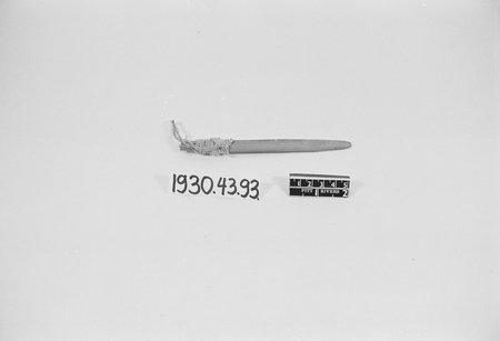 A Yoruba slat, tapering and cord-wound near the handle, stands in for the single painted bull-roarer that the Smithsonian's 1915 exhibition...