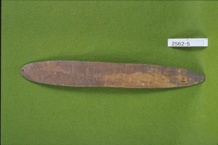 An Aboriginal Australian bullroarer of the general elongated-oval type, finely grained and pierced with a single suspension hole at one end;...