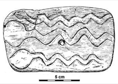 Comparison image — The Mal'ta ivory plaque, snake-engraved face, with its central perforation (5 cm scale). The central hole is why it could...