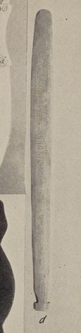 Plate 11, item d: a Makah bull-roarer blade (the Klokali-ceremony blade, photographed without its cord) from Densmore's Nootka and Quileute...