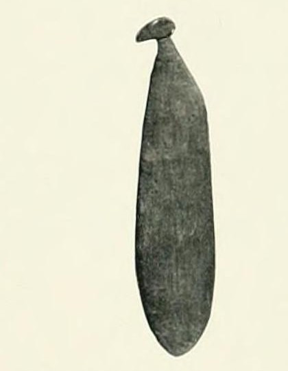 Haddon's photograph of a small dark western Torres Strait wanes bullroarer with a knobbed head.